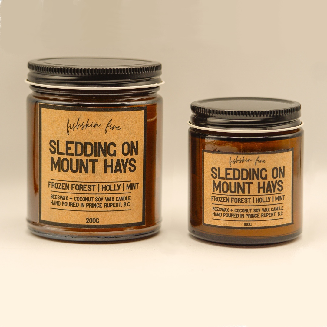 Two candles with labels on a neutral background